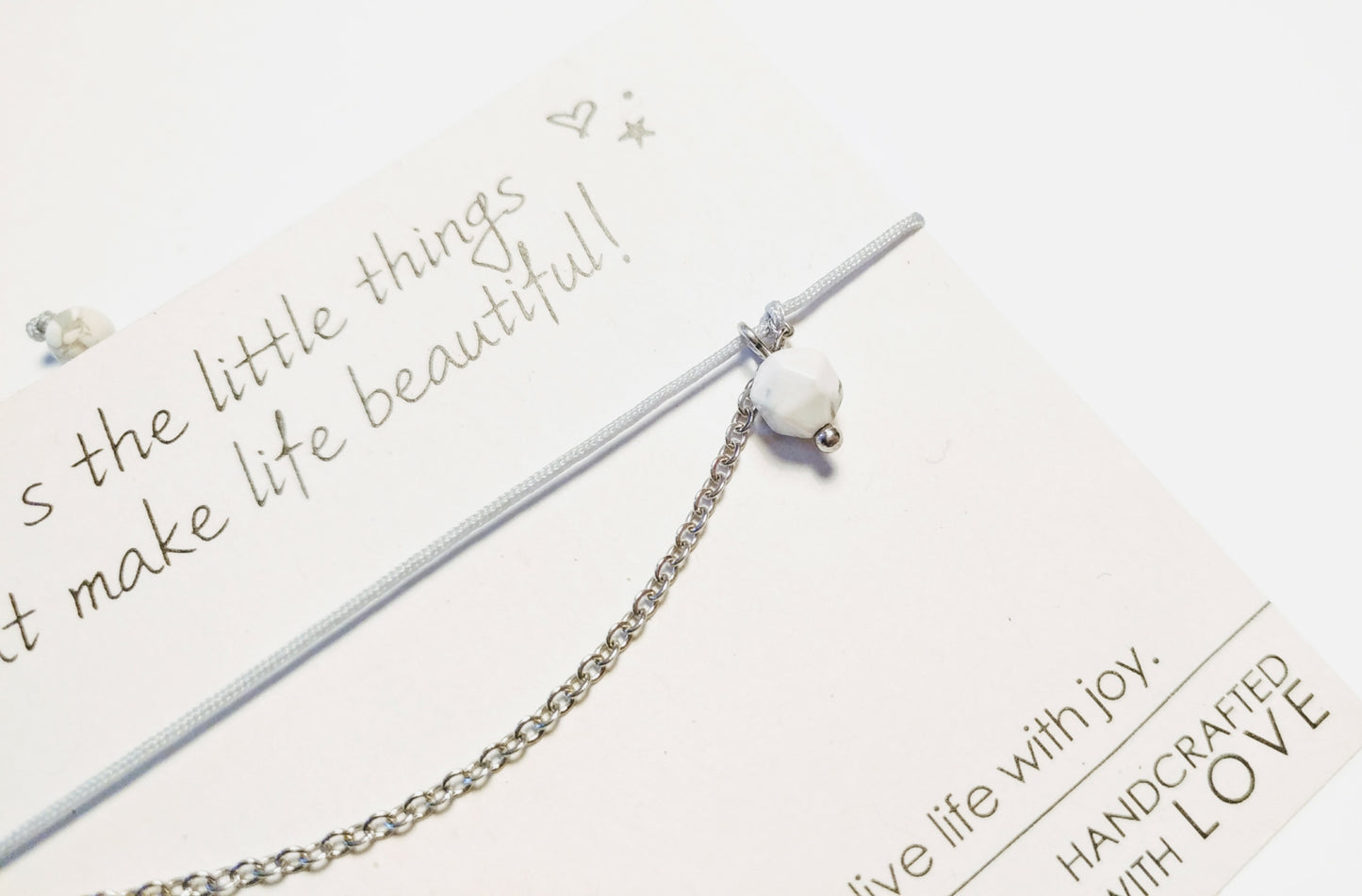 Delicate bracelet with stainless steel, gemstone pendant and textile cord