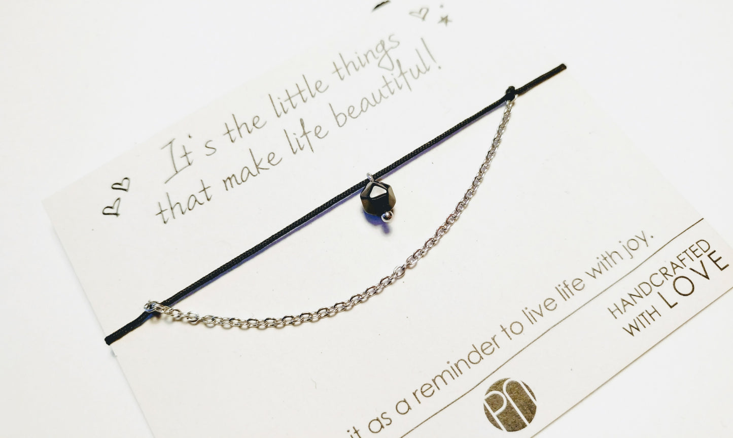 Delicate bracelet with stainless steel, gemstone pendant and textile cord
