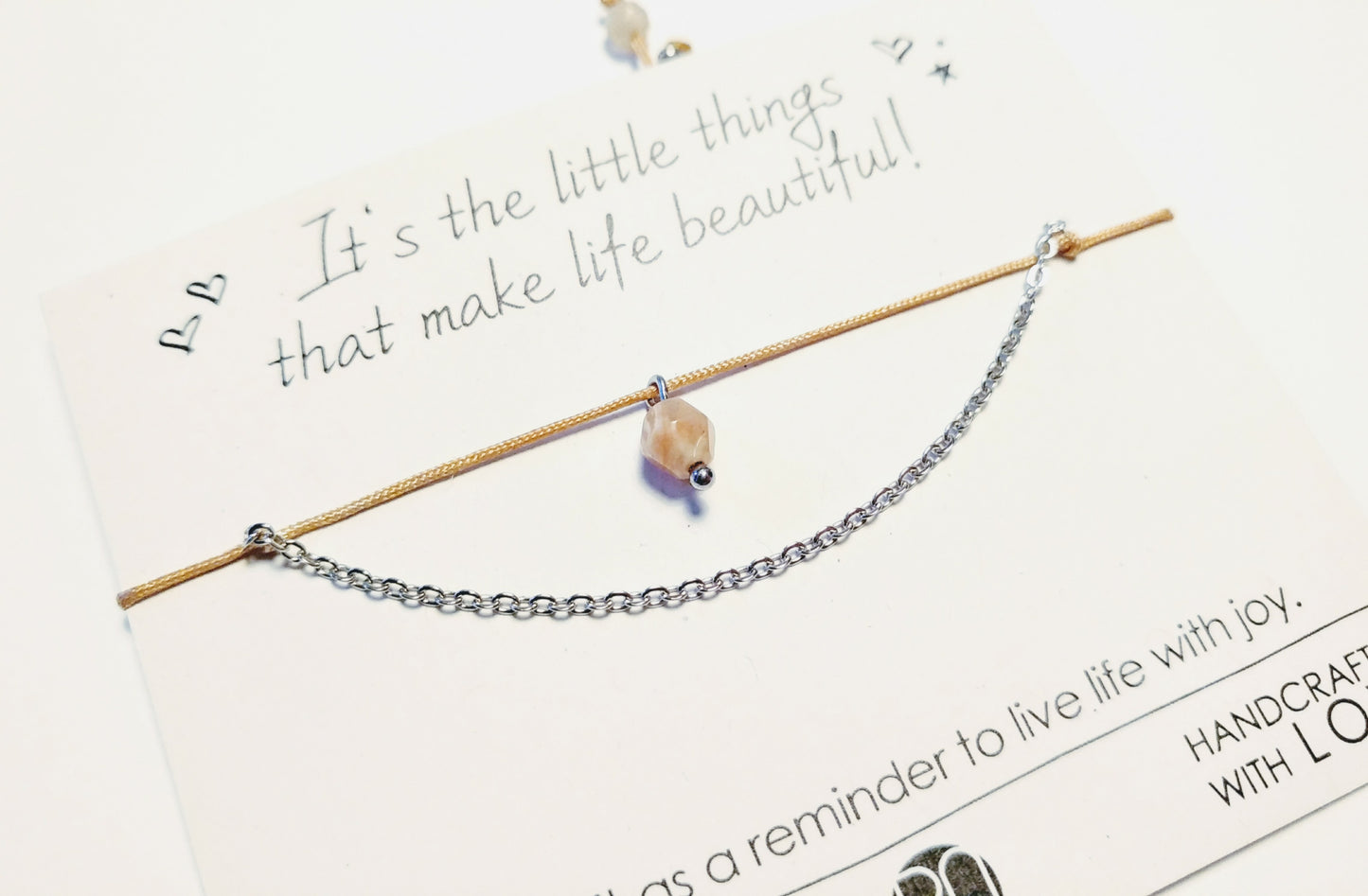 Delicate bracelet with stainless steel, gemstone pendant and textile cord