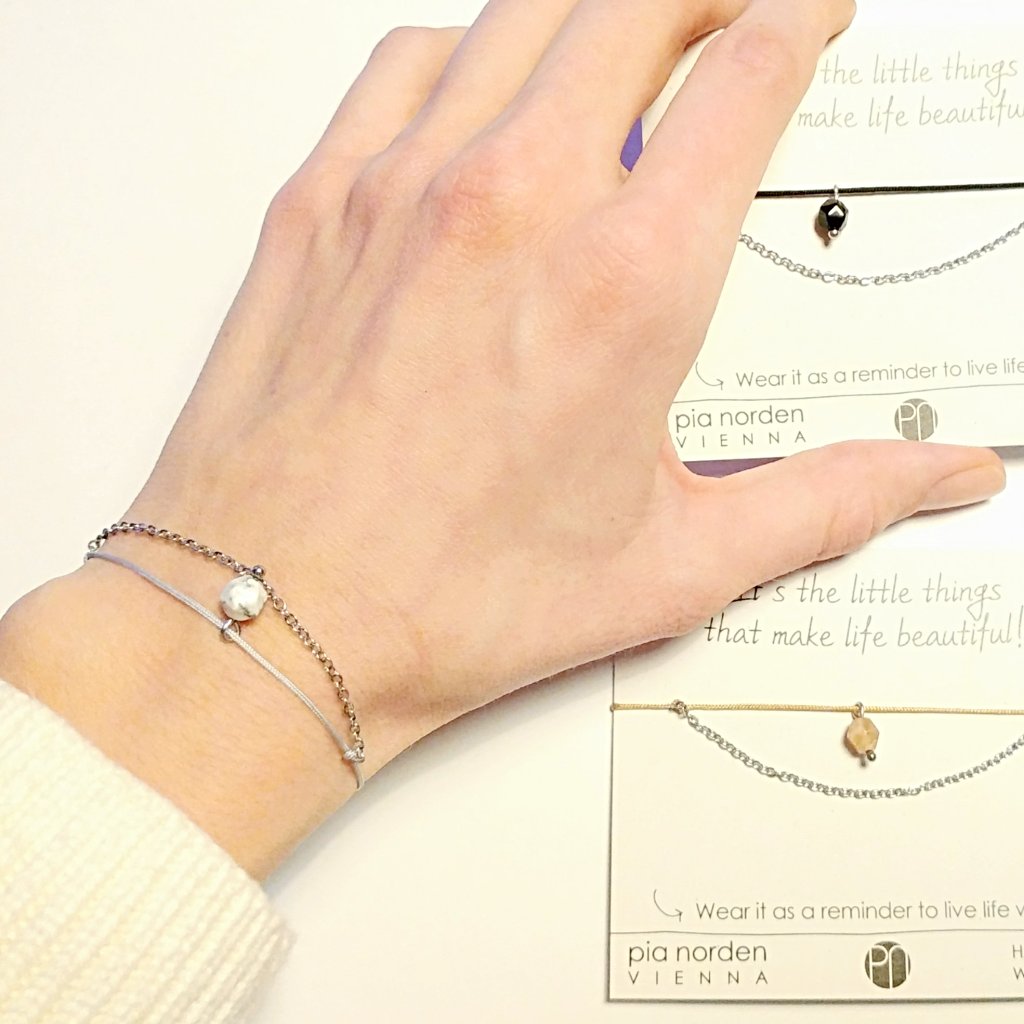 Delicate bracelet with stainless steel, gemstone pendant and textile cord