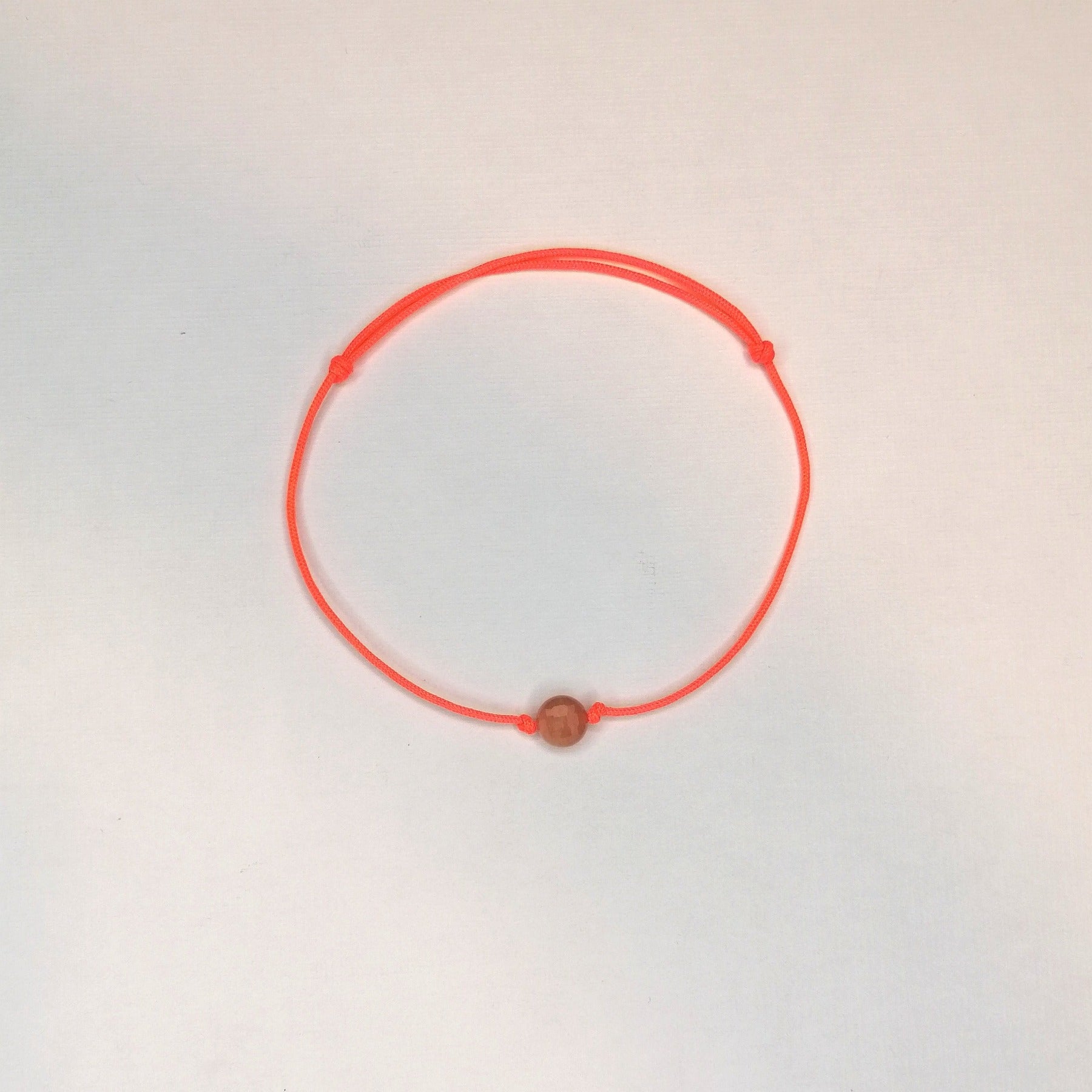 orange rosa Sonnenstein Armband mit Nylonkordel in neonorange von pia norden